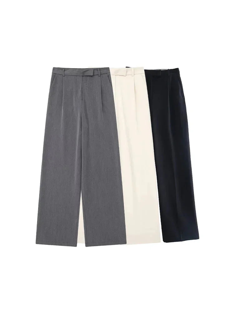 Calças femininas vintage de cintura alta com fecho frontal, corte reto e estilo chic.