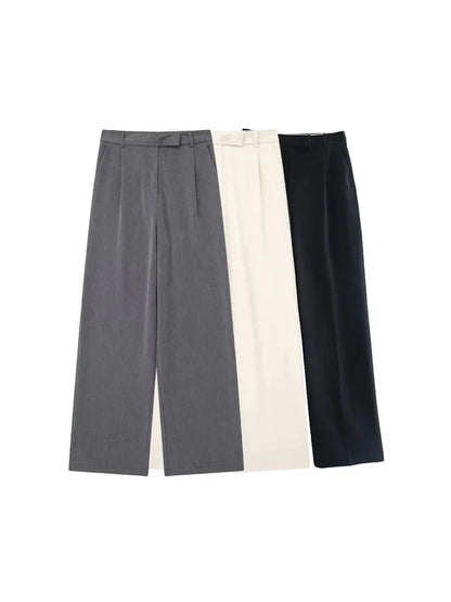 Calças femininas vintage de cintura alta com fecho frontal, corte reto e estilo chic.